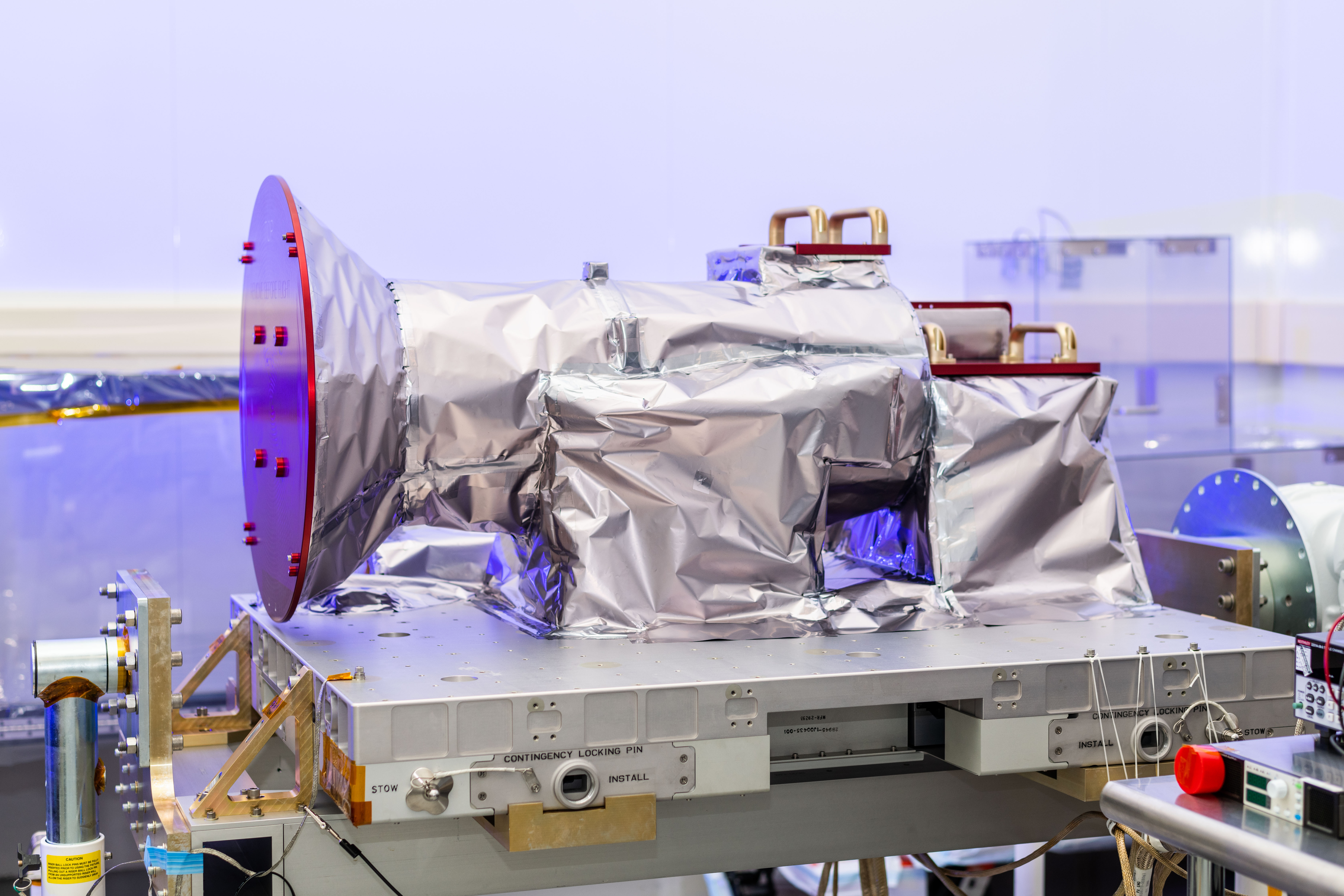 The Atmospheric Waves Experiment (AWE) payload pictured in a lab with its remove-before-flight covers installed.