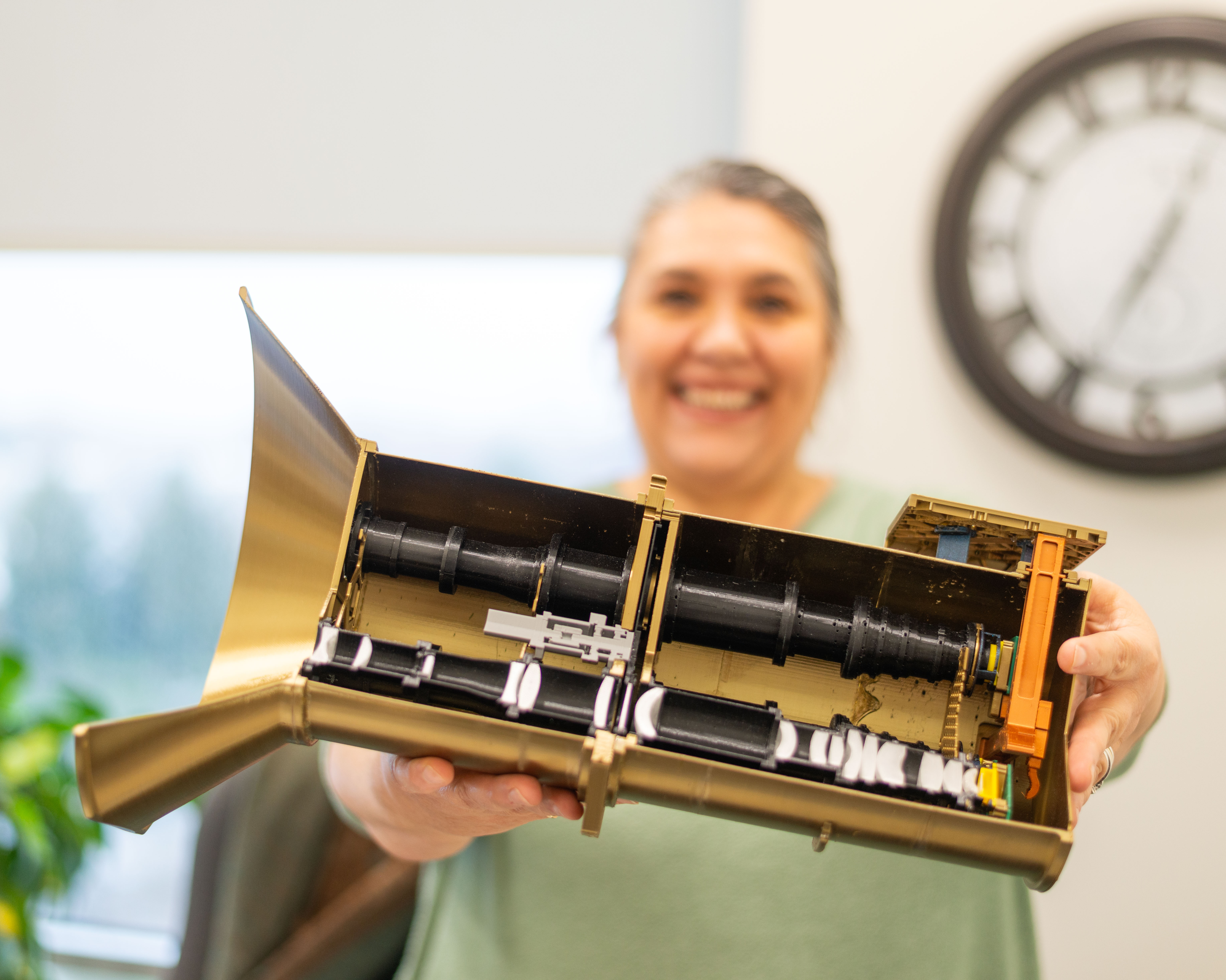 Sherri holding up the AWE instrument model.